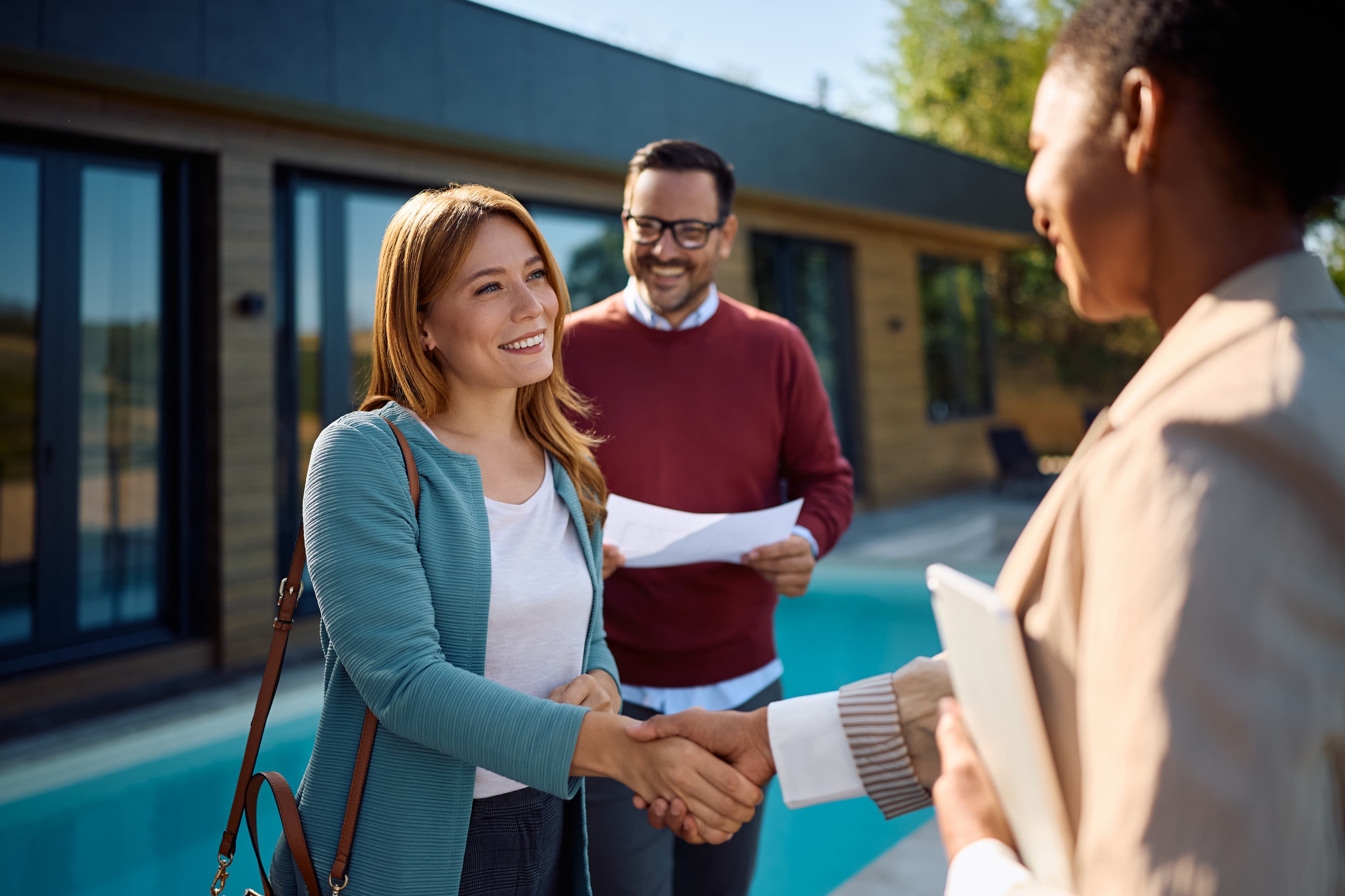 Real estate clients reviewing plans